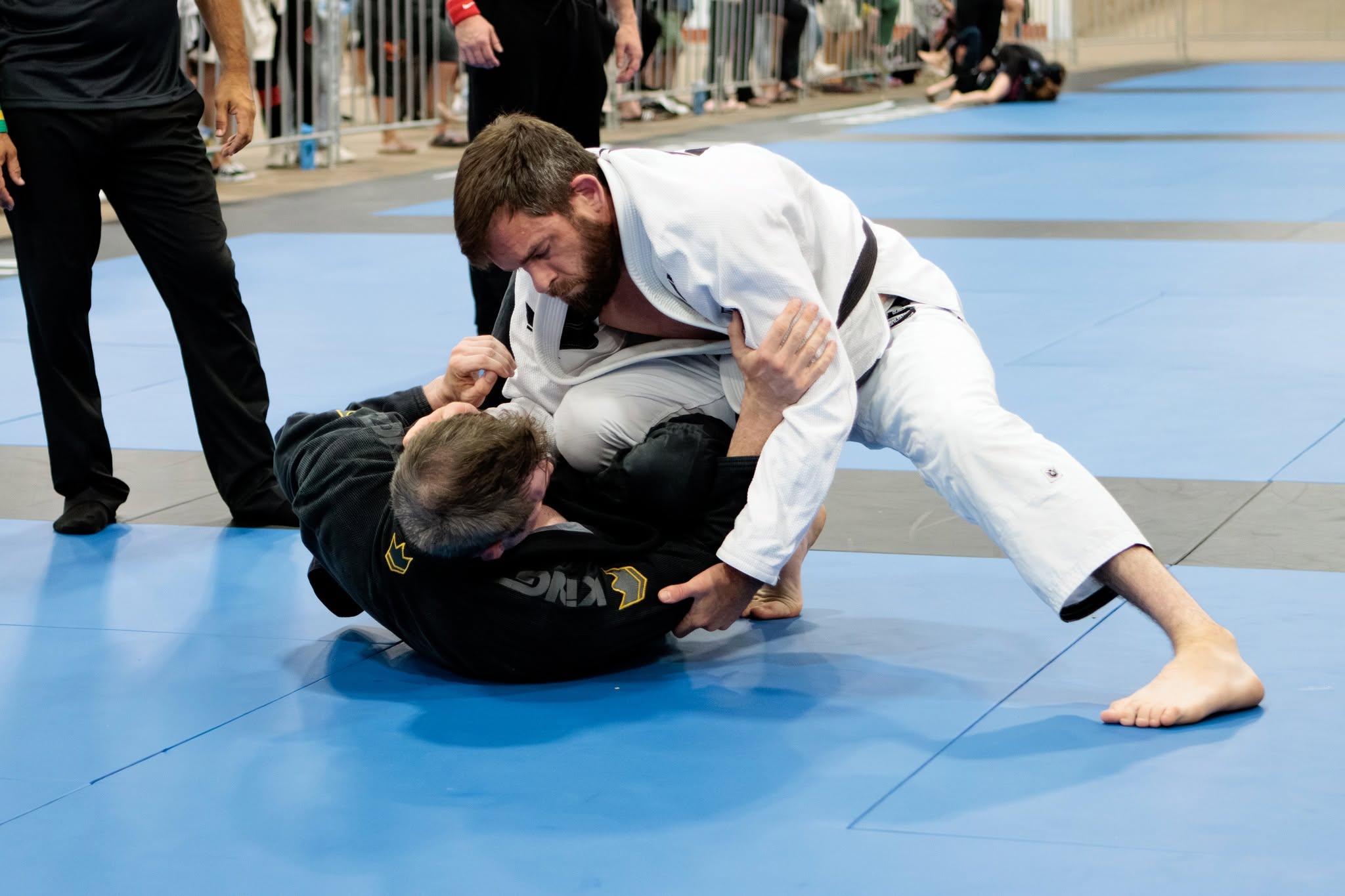 Two competitors grappling in the gi at a Nova Scotia tournament